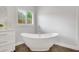 Bright bathroom featuring a soaking tub, and tile floors at 1473 Cardova Pointe, Dunwoody, GA 30338