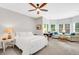 A bright bedroom that has a ceiling fan and many windows that let in natural light at 1473 Cardova Pointe, Dunwoody, GA 30338