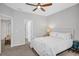 A bedroom with a ceiling fan, carpet, and white walls with white trim at 1473 Cardova Pointe, Dunwoody, GA 30338