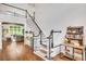 Bright entryway featuring hardwood floors, staircase, and a view into the living room at 1473 Cardova Pointe, Dunwoody, GA 30338