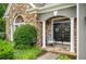 Charming entryway with stone accents, double doors, and a cozy rocking chair at 1473 Cardova Pointe, Dunwoody, GA 30338