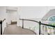 Bright hallway showcasing a curved railing and view to the main level of the home at 1473 Cardova Pointe, Dunwoody, GA 30338