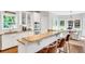 Kitchen featuring granite countertops, an island with bar seating and stainless appliances at 1473 Cardova Pointe, Dunwoody, GA 30338