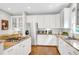 Bright kitchen features white cabinetry, stainless steel appliances, and granite countertops at 1473 Cardova Pointe, Dunwoody, GA 30338