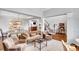 Spacious living room with hardwood floors, elegant furniture, and an open staircase leading to the upper level at 1473 Cardova Pointe, Dunwoody, GA 30338