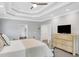 Charming main bedroom features television and entry to ensuite bathroom at 1473 Cardova Pointe, Dunwoody, GA 30338