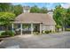 Community pool entrance features shaded seating and clear access, enhancing the neighborhood's recreational amenities at 1473 Cardova Pointe, Dunwoody, GA 30338