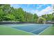 Well maintained community tennis courts, surrounded by lush greenery, offering a great recreational space at 1473 Cardova Pointe, Dunwoody, GA 30338