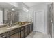 Large bathroom with granite countertops, dual sinks, a glass-enclosed shower, and neutral finishes at 2772 Archway Ln, Brookhaven, GA 30341