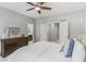 Comfortable bedroom with a ceiling fan, neutral color scheme, and bright natural light at 2772 Archway Ln, Brookhaven, GA 30341