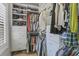 Walk-in closet with custom shelving, ample storage space, and an organized layout at 2772 Archway Ln, Brookhaven, GA 30341