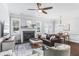 Stylish living room featuring a fireplace, dining area, and comfortable seating, ideal for modern living at 2772 Archway Ln, Brookhaven, GA 30341