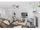 Bright living room features a fireplace, a large TV and ample seating for a cozy atmosphere at 2772 Archway Ln, Brookhaven, GA 30341