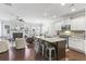 Open-concept living area featuring a modern kitchen, spacious seating, and a cozy fireplace at 2772 Archway Ln, Brookhaven, GA 30341