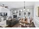 Open-concept living room with fireplace, hardwood floors, and lots of natural light at 2772 Archway Ln, Brookhaven, GA 30341