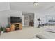 Open concept living space featuring a large screen television, entertainment center, and a home office area at 2772 Archway Ln, Brookhaven, GA 30341