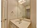 Well-lit bathroom with a single sink vanity and neutral decor at 3411 Lindenridge Dr, Buford, GA 30519