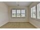Bright bedroom featuring neutral carpet and ample natural light from the window with shutters at 3411 Lindenridge Dr, Buford, GA 30519