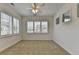 Sunny bedroom with carpet, white shutters, and plenty of natural light at 3411 Lindenridge Dr, Buford, GA 30519