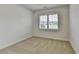 Clean and simple bedroom featuring neutral carpet and a window for natural light at 3411 Lindenridge Dr, Buford, GA 30519