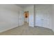 Bright bedroom featuring neutral walls and plush carpeting, offering a warm and inviting retreat at 3411 Lindenridge Dr, Buford, GA 30519