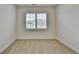 Cozy bedroom bathed in natural light, showcasing a serene space with a view from its large window at 3411 Lindenridge Dr, Buford, GA 30519