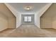Large bonus room with carpet flooring and natural light, perfect for flexible living at 3411 Lindenridge Dr, Buford, GA 30519