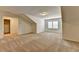 Large bonus room with carpet flooring and natural light, perfect for flexible living at 3411 Lindenridge Dr, Buford, GA 30519