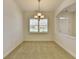 Dining room featuring a decorative chandelier, white trim, and a window providing natural light at 3411 Lindenridge Dr, Buford, GA 30519