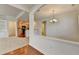 Bright dining area featuring an elegant chandelier and open access to the kitchen at 3411 Lindenridge Dr, Buford, GA 30519