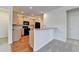 Modern kitchen featuring wood cabinets, granite countertops, and stainless steel appliances at 3411 Lindenridge Dr, Buford, GA 30519