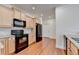 Bright kitchen featuring stainless steel appliances, granite countertops, and light wood cabinetry at 3411 Lindenridge Dr, Buford, GA 30519