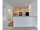 Bright, modern kitchen with granite countertops and wood cabinets at 3411 Lindenridge Dr, Buford, GA 30519