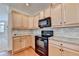 Modern kitchen with updated appliances, granite countertops, and ample cabinet space for storage at 3411 Lindenridge Dr, Buford, GA 30519