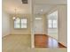 Open-concept living and dining area featuring neutral carpet, white trim, and bright windows at 3411 Lindenridge Dr, Buford, GA 30519