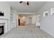 Bright living room featuring a fireplace, recessed lighting, and open access to the kitchen at 3411 Lindenridge Dr, Buford, GA 30519