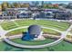 Aerial view of amphitheater with pond and tiered seating area at a mixed use development at 4545 Greyson Manor Dr, Cumming, GA 30041