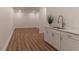 Spacious basement featuring white walls, recessed lighting, and a modern bar area at 607 Hickory Creek Ln, Woodstock, GA 30188