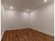 Bright basement featuring recessed lighting, white walls, and wood look flooring at 607 Hickory Creek Ln, Woodstock, GA 30188
