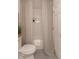 Cozy bathroom featuring a shower with a shower curtain and a toilet at 607 Hickory Creek Ln, Woodstock, GA 30188