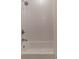 Clean and modern bathroom featuring a white shower and tub with decorative tiled walls at 607 Hickory Creek Ln, Woodstock, GA 30188