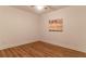 Bright bedroom with wood-look flooring, neutral walls, and modern ceiling fan at 607 Hickory Creek Ln, Woodstock, GA 30188