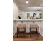 Stylish kitchen island with seating, perfect for casual dining and entertaining, open to living room at 607 Hickory Creek Ln, Woodstock, GA 30188