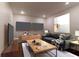 Comfortable living room with a television, sofa, and modern decor at 607 Hickory Creek Ln, Woodstock, GA 30188