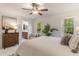 Bright main bedroom with two windows and an ensuite bathroom at 607 Hickory Creek Ln, Woodstock, GA 30188