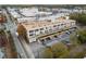 Aerial view of a brick building near businesses, capturing an urban neighborhood setting at 881 Memorial Se Dr # 116, Atlanta, GA 30316