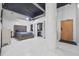 Stylish bedroom with tufted headboard, closet, and industrial ceiling features at 881 Memorial Se Dr # 116, Atlanta, GA 30316