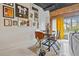 Bright dining area features exposed brick, sports-themed wall art, and an abundance of natural light at 881 Memorial Se Dr # 116, Atlanta, GA 30316