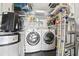 Organized laundry room features modern washer and dryer with ample shelving at 881 Memorial Se Dr # 116, Atlanta, GA 30316