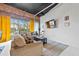 Spacious living room with exposed brick, comfy sectional, and large windows for natural light at 881 Memorial Se Dr # 116, Atlanta, GA 30316